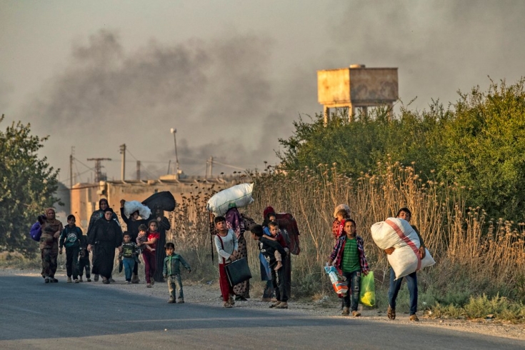 Civiles huyen de los bombardeos turcos en el norte de Siria. Octubre de 2019.